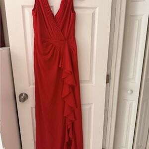 Aidan Mattox Red Crepe Chiffon V-neck Gown a ruched bodice side ruffles.